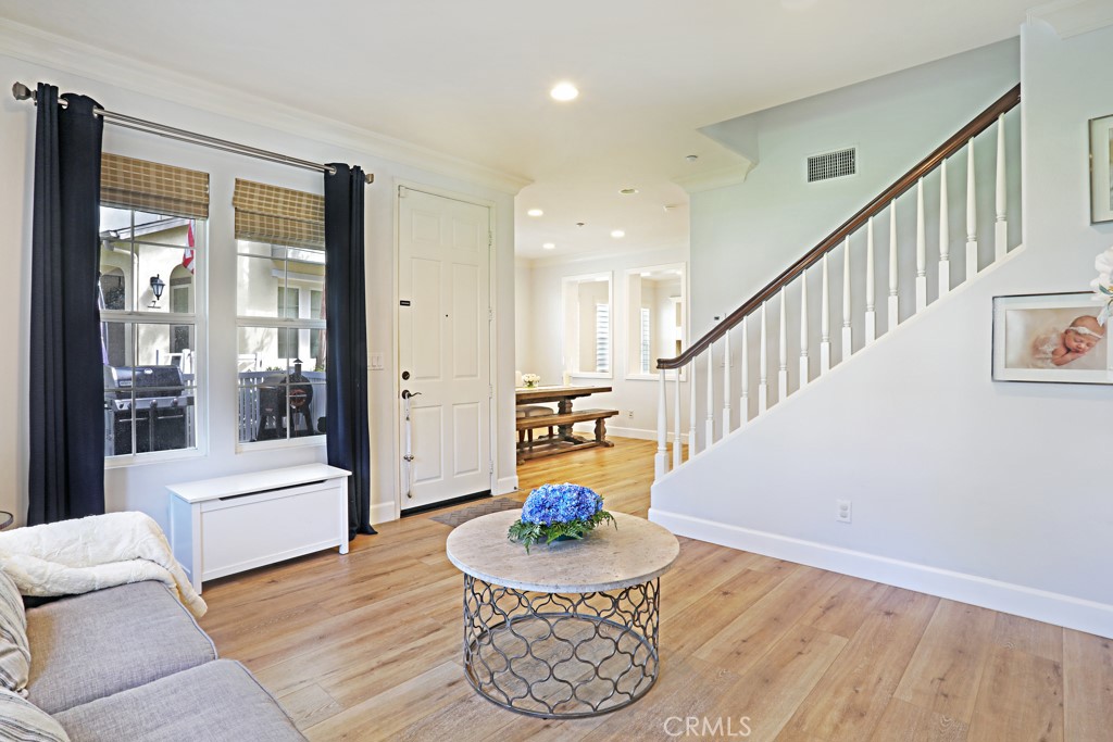9 Orange Blossom Circle Ladera Ranch, CA 92694 - Photo 4 of 24 a living room with furniture and a table