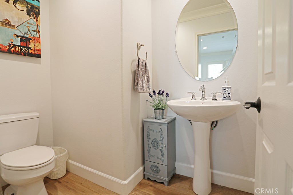 9 Orange Blossom Circle Ladera Ranch, CA 92694 - Photo 8 of 24 a bathroom with a sink mirror and toilet