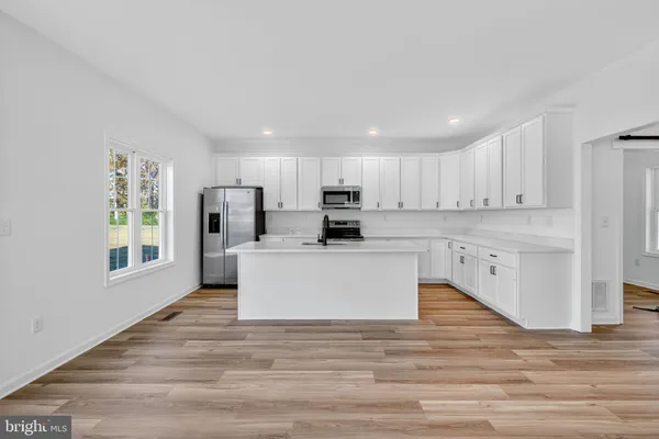 a view of kitchen with wooden floor