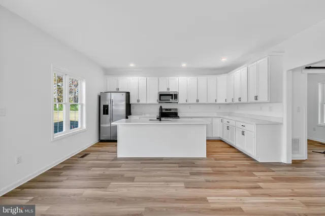 a view of kitchen with wooden floor