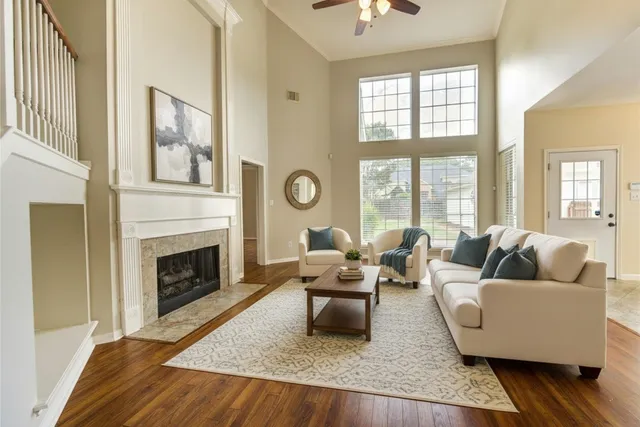 a bathroom with a granite countertop sink a toilet a mirror and bathtub