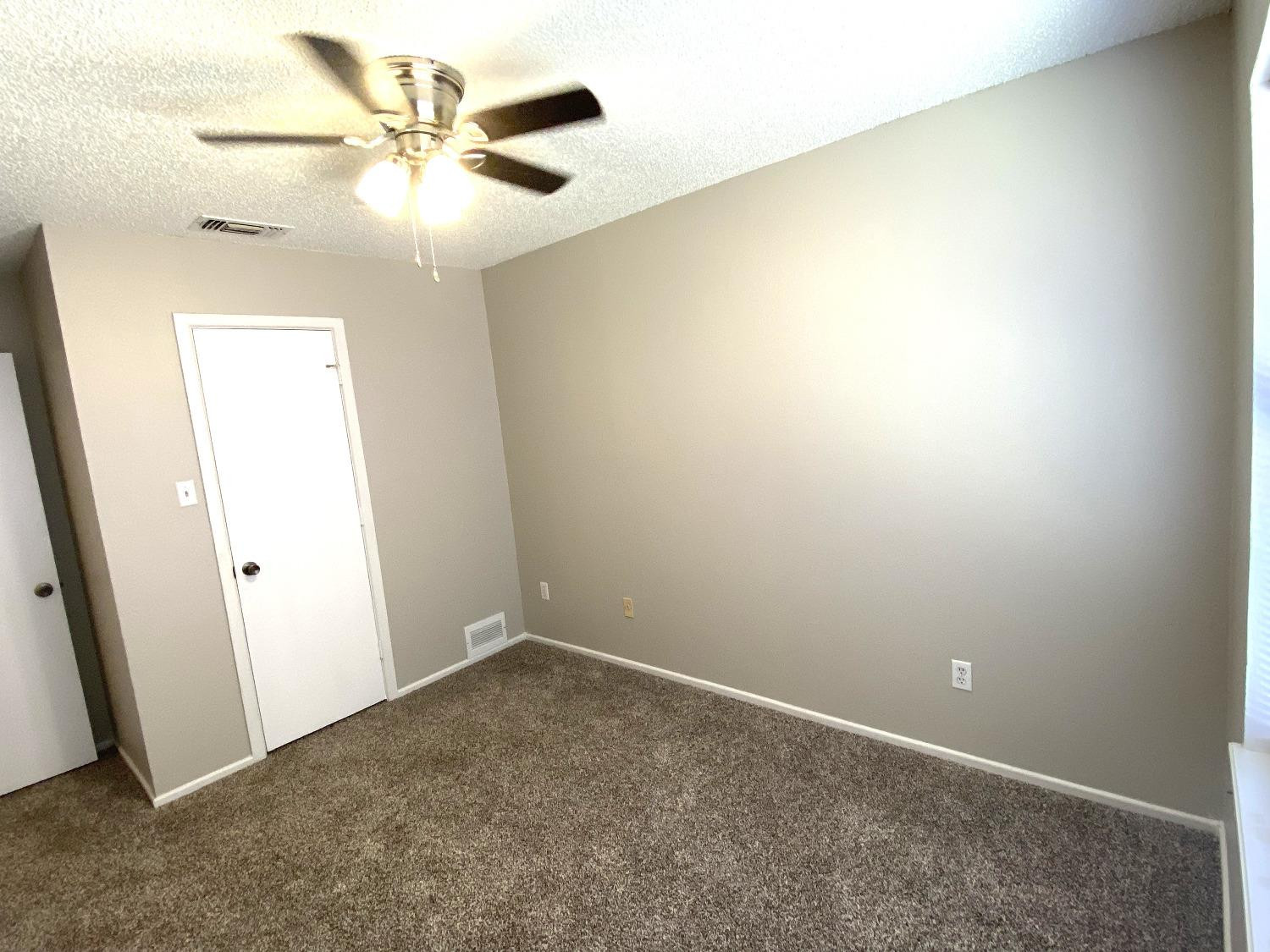 9818 Jordan Avenue, Unit A Lubbock, TX 79423 - Photo 13 of 20 an empty room