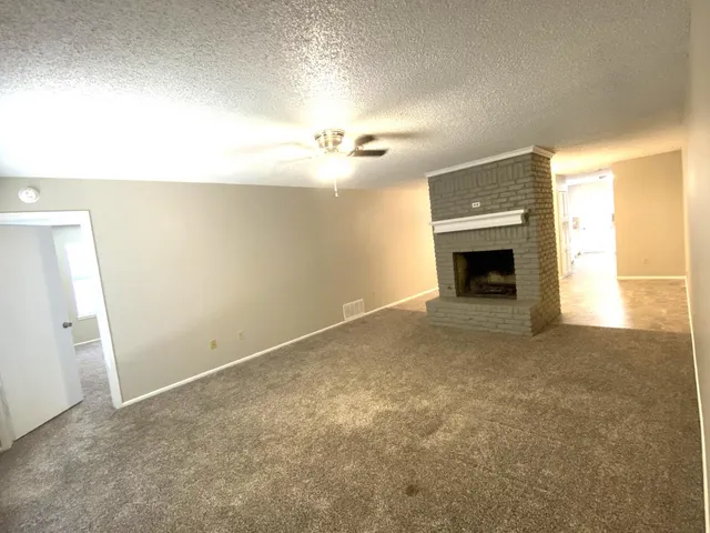 an empty room with a empty space and a window