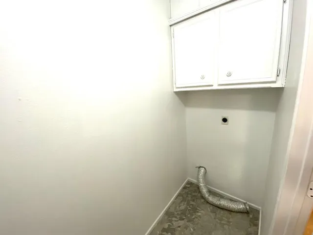 a view of a chandelier fan in a room