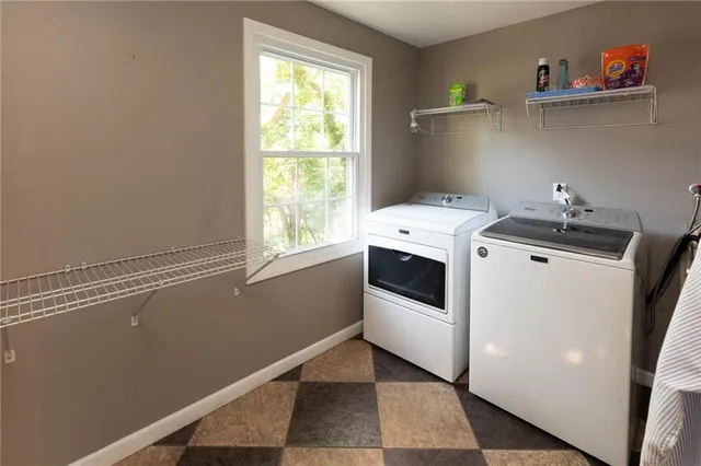 a bedroom with a bed and a television