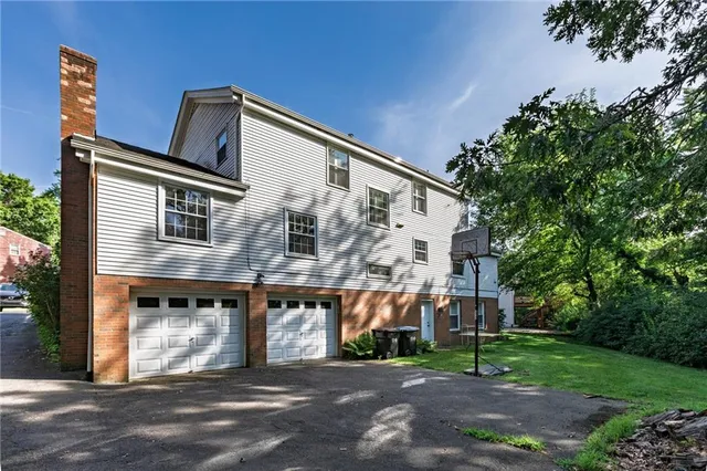 a view of a backyard with sitting area