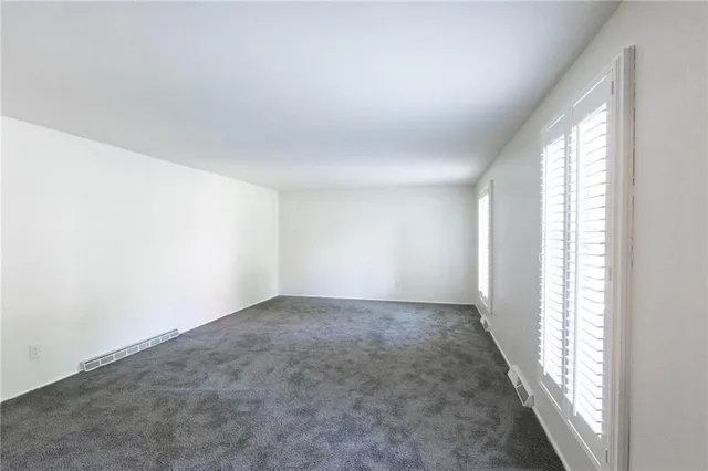 an empty room with windows