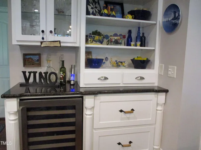 a stove top oven sitting inside of a kitchen and a sink