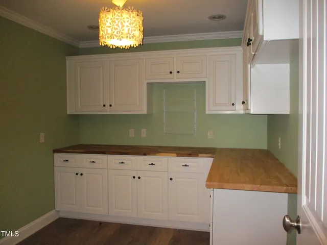 a view of cabinets and window