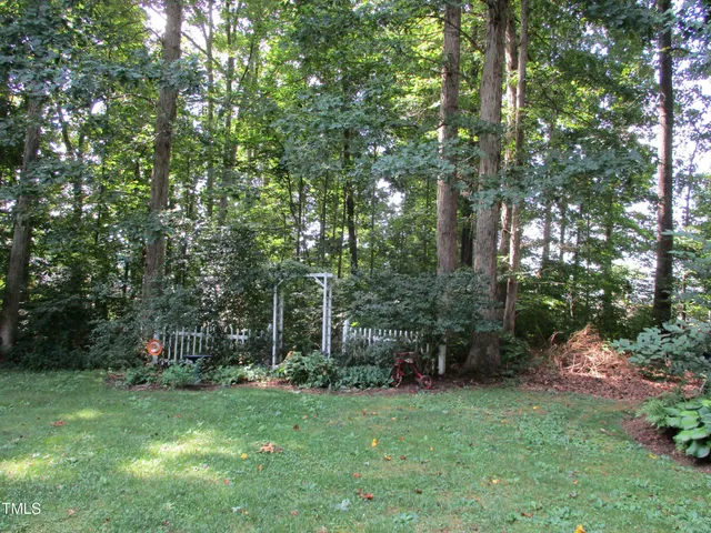 a view of a backyard with garden