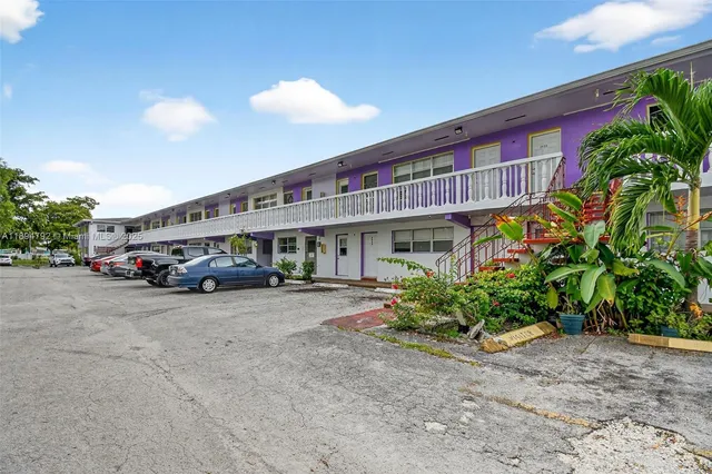 a front view of a building with garden