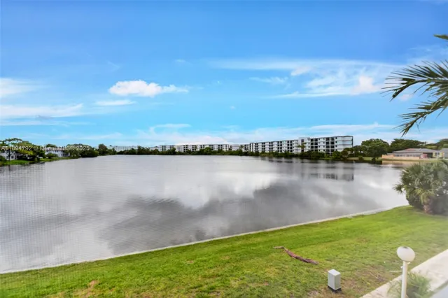 a view of a lake with houses with outdoor space
