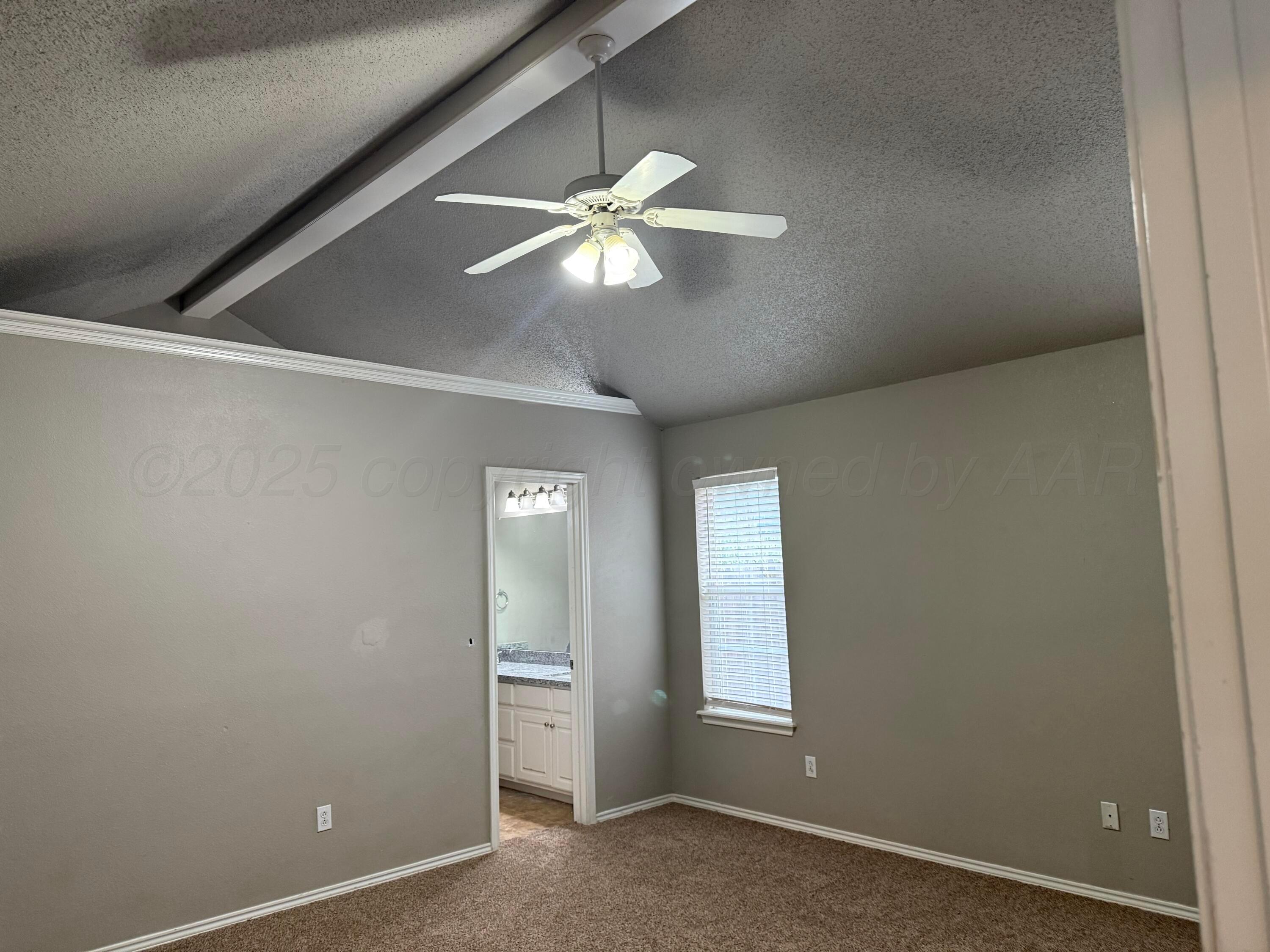 1918 75th Street Lubbock, TX 79423 - Photo 10 of 23 an empty room with closet and a chandelier fan