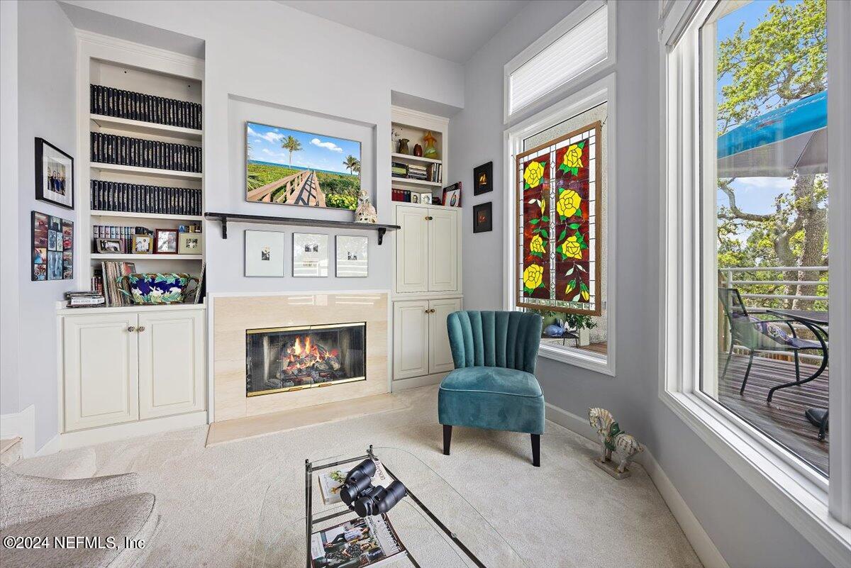 3419 Lands End Drive St. Augustine, FL 32084 - Photo 11 of 59 a living room with furniture and a fireplace