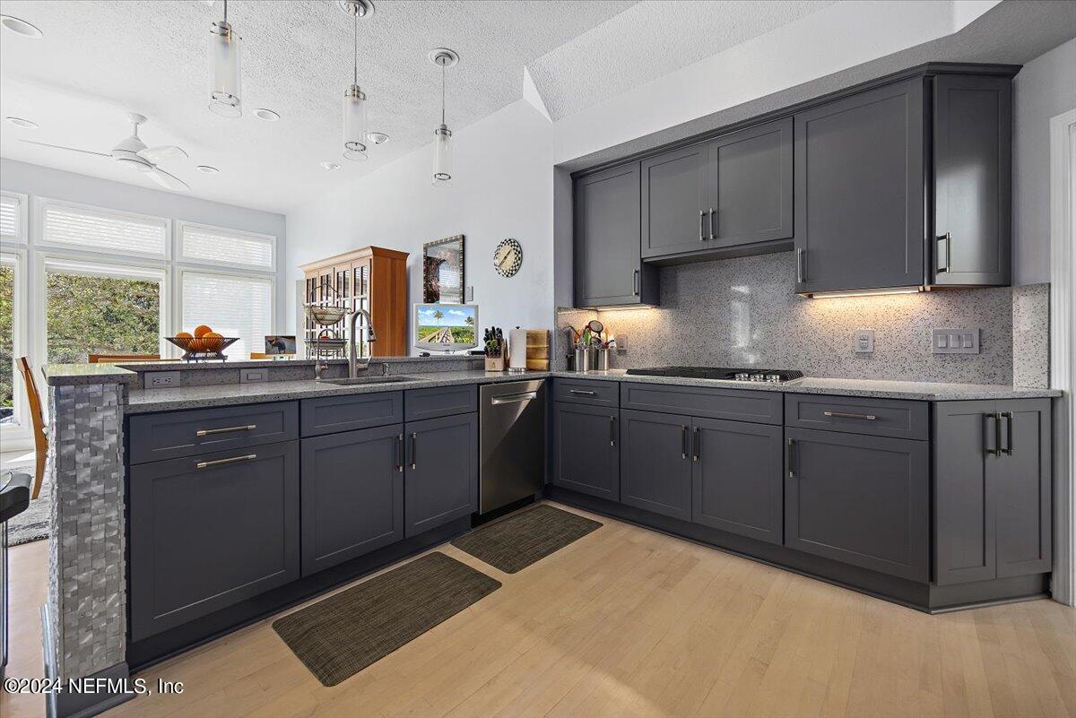 3419 Lands End Drive St. Augustine, FL 32084 - Photo 19 of 59 a kitchen with a sink a stove and cabinets
