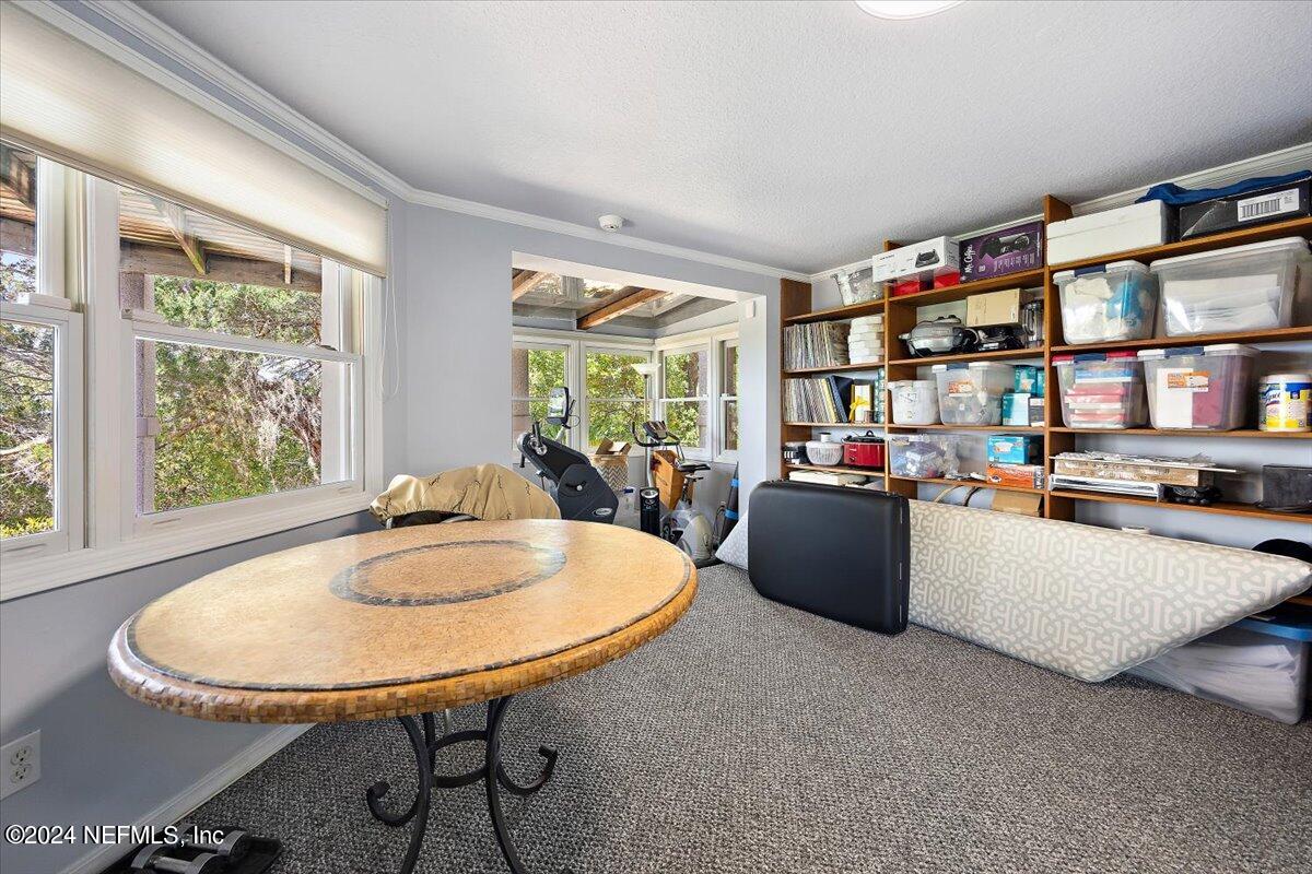 3419 Lands End Drive St. Augustine, FL 32084 - Photo 26 of 59 a living room with furniture and a table