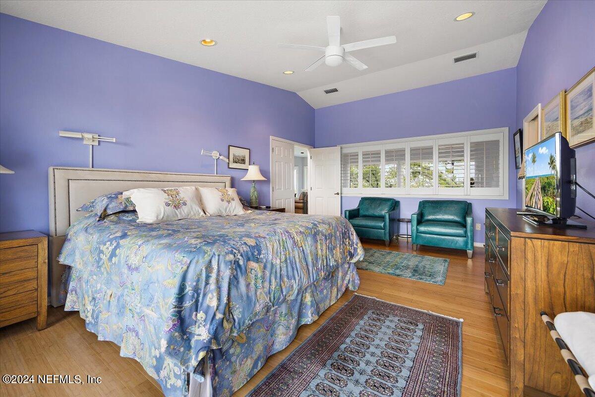 3419 Lands End Drive St. Augustine, FL 32084 - Photo 29 of 59 a bedroom with a bed and wooden floor