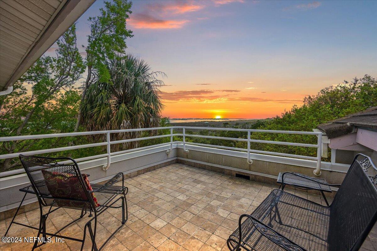 3419 Lands End Drive St. Augustine, FL 32084 - Photo 36 of 59 a view of a roof deck with wooden floor and seating space