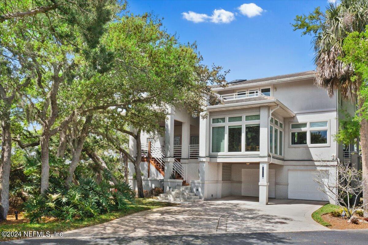3419 Lands End Drive St. Augustine, FL 32084 - Photo 4 of 59 a front view of a house with garden