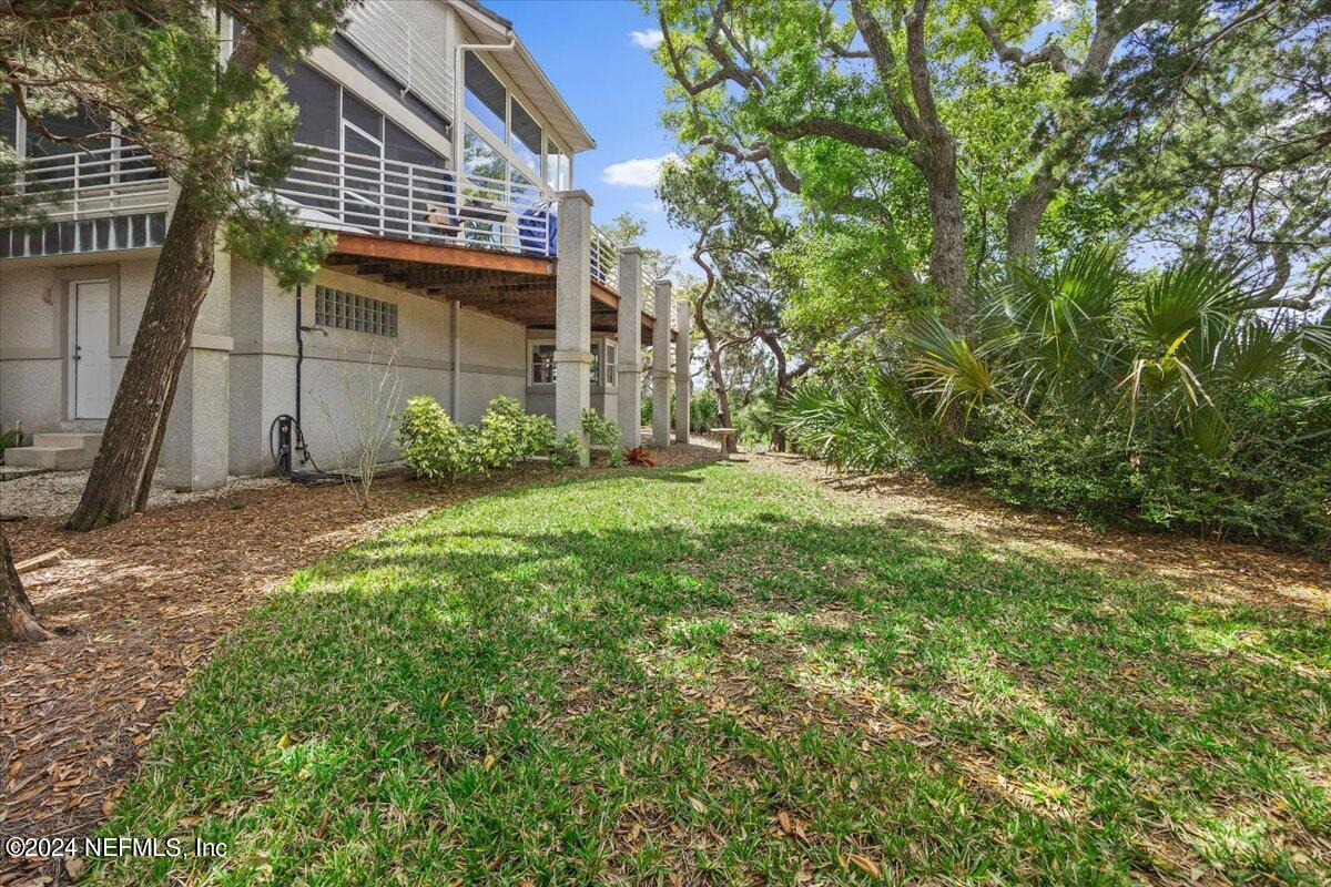 3419 Lands End Drive St. Augustine, FL 32084 - Photo 49 of 59 a backyard of a house with lots of green space