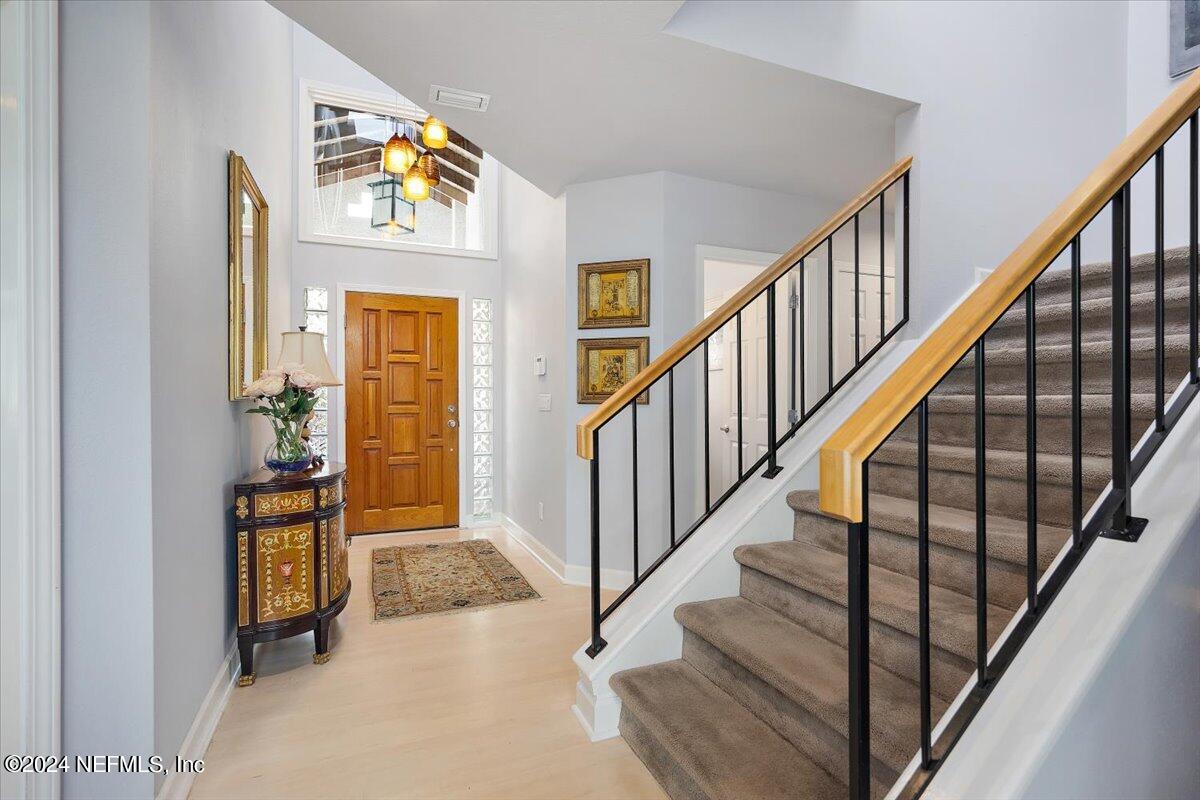 3419 Lands End Drive St. Augustine, FL 32084 - Photo 7 of 59 a view of an entryway with wooden floor and a livingroom view