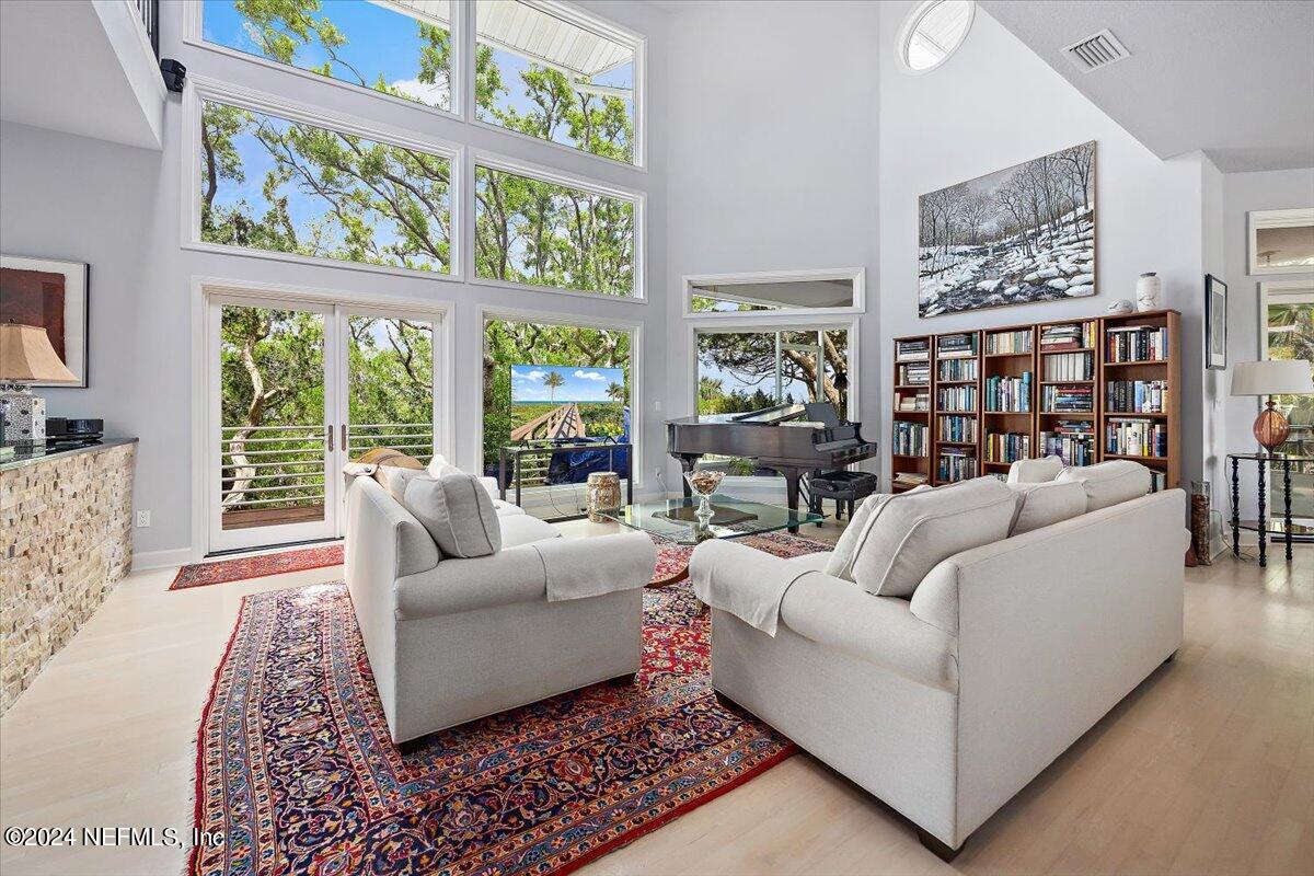 3419 Lands End Drive St. Augustine, FL 32084 - Photo 9 of 59 a living room with furniture and a large window