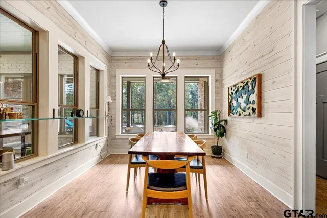 a dining room with a table and chairs