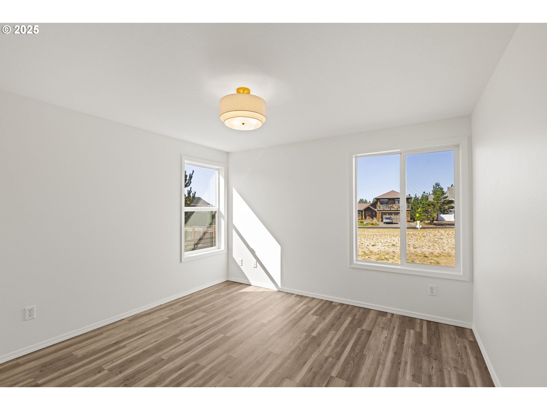 9980 Pine Ridge Drive Nehalem, OR 97131 - Photo 19 of 27 a view of an empty room and window