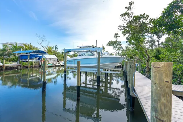 an aerial view of a house with a lake view
