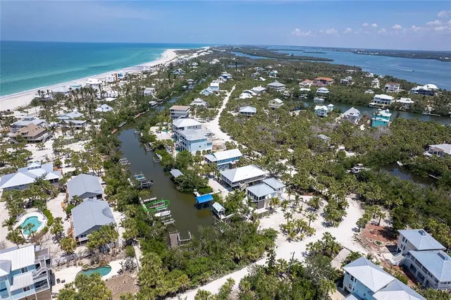 an aerial view of house with yard