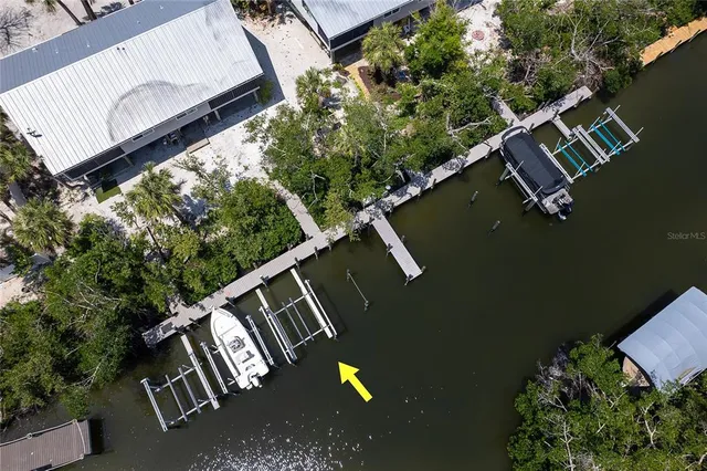 a view of a swimming pool with a patio and a yard