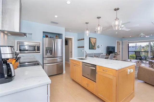 a bedroom with a large bed and a large window