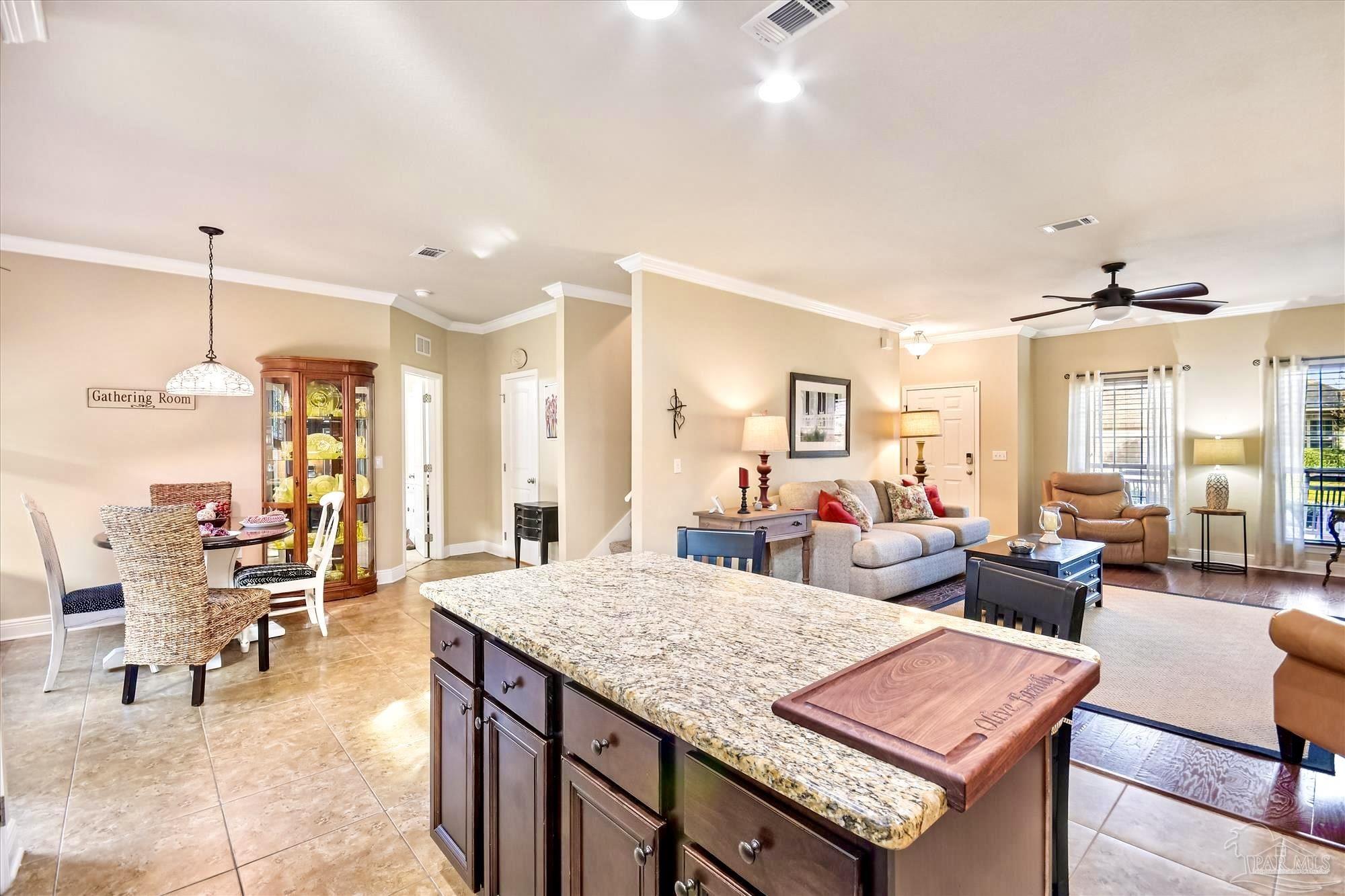 745 Farmington Road Pensacola, FL 32504 - Photo 12 of 25 a living room with furniture a table and chairs