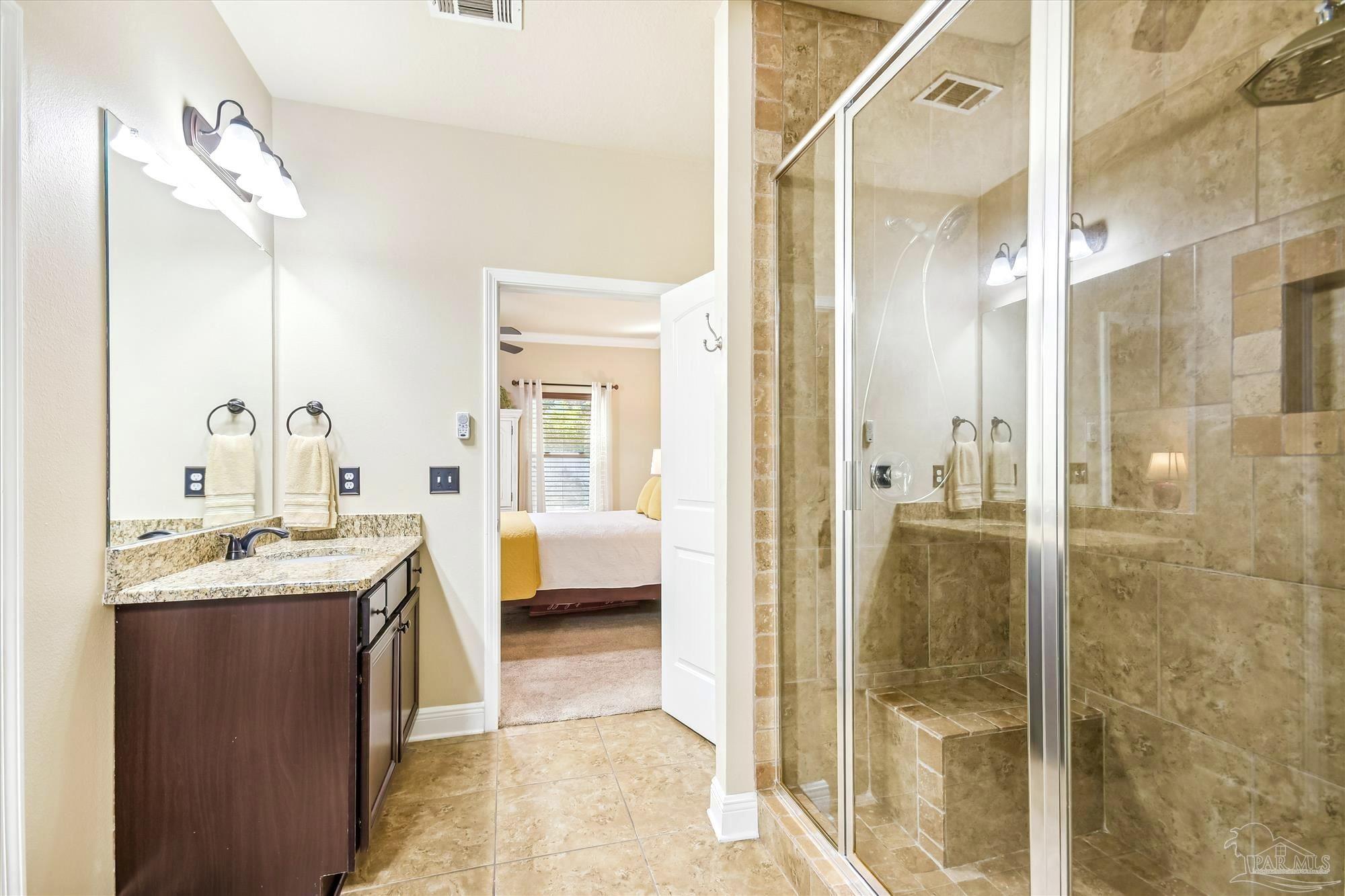 745 Farmington Road Pensacola, FL 32504 - Photo 19 of 25 a en suite bathroom with a tub sink and shower