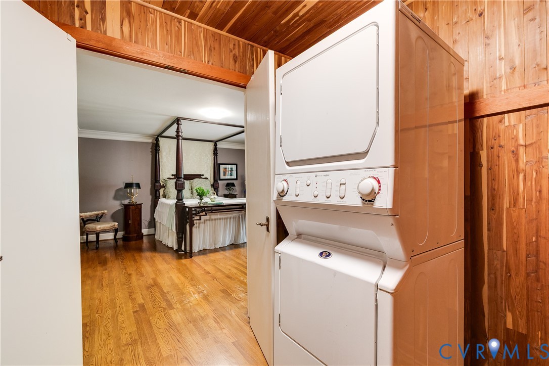 10475 Cherokee Road Richmond, VA 23235 - Photo 39 of 74 Integrated laundry appliances with wood paneling.