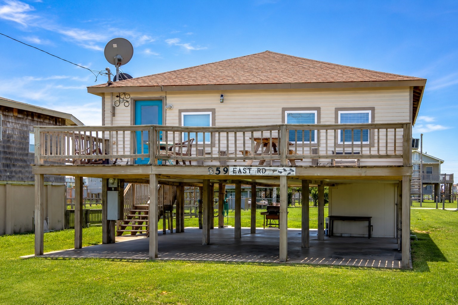 a front view of a house with swimming pool having outdoor seating
