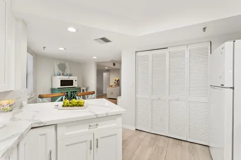 a bathroom with a sink a mirror and a shower