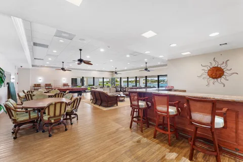 a view of a dining area with furniture and wooden floor