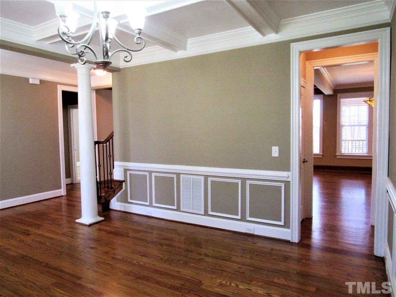 3604 Arthur Pierce Road Apex, NC 27539 - Photo 5 of 30 Features beautifully refinished hardwood floors with a coffered ceiling and wainscotting.
