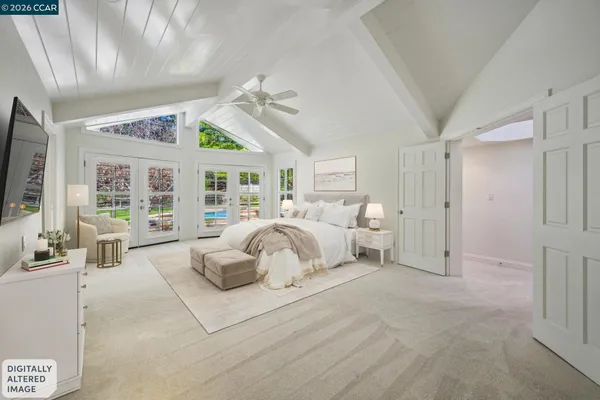 an empty room with windows and ceiling fan