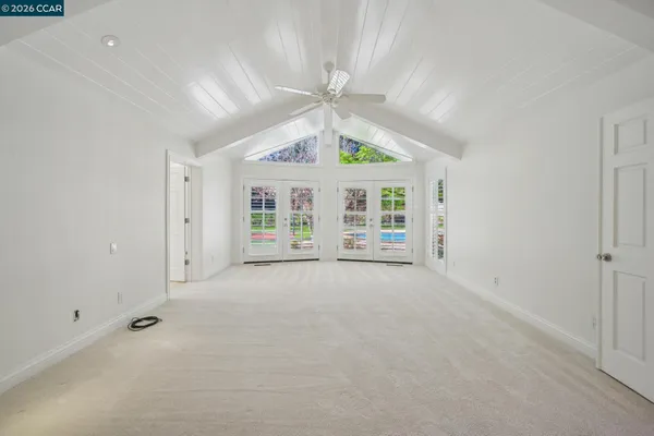 a bathroom with a tub a sink and a large mirror