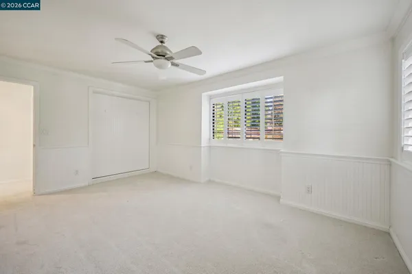 a view of a house with swimming pool and sitting area