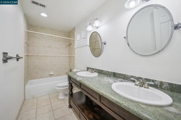 a view of swimming pool with lounge chairs