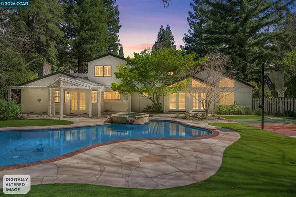 a view of a house with swimming pool
