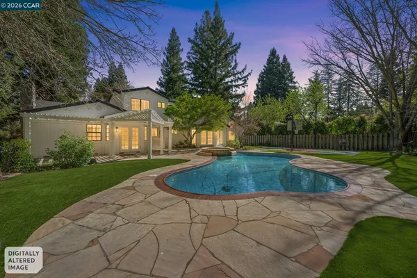 a view of a yard with swimming pool