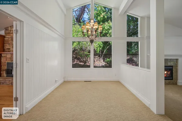 a living room with furniture a fireplace and a table