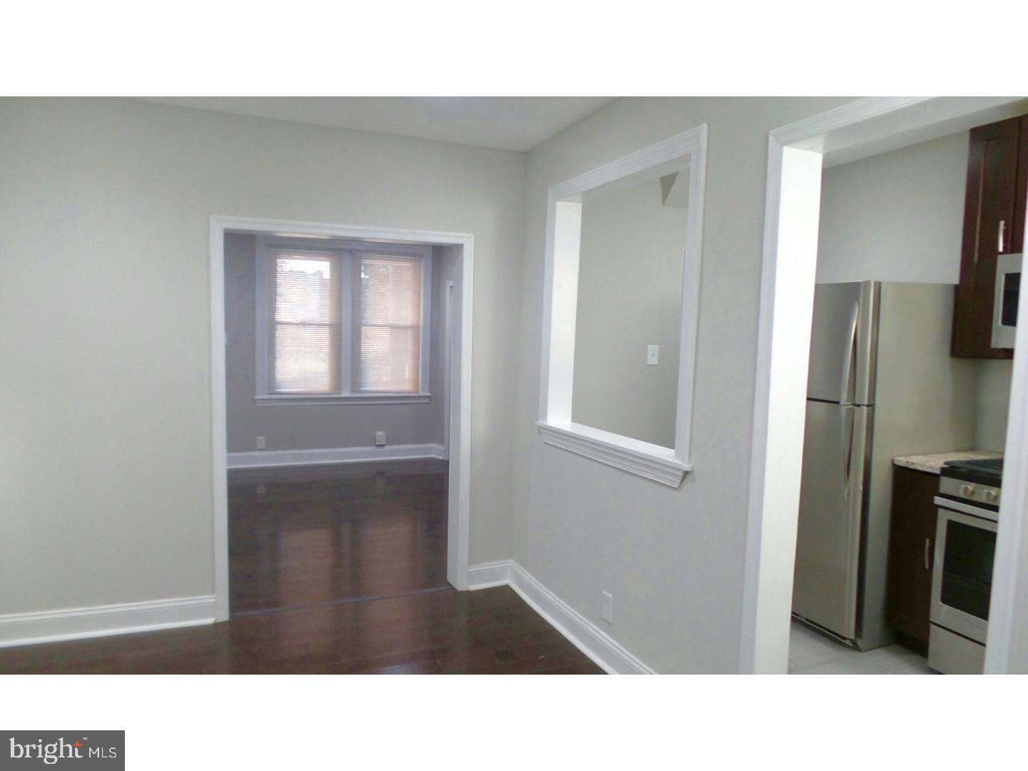 1640 South 28th Street Philadelphia, PA 19145 - Photo 10 of 24 a open kitchen with sink and refrigerator