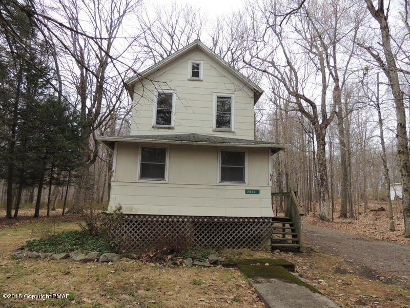 2800 Locust Ridge Road Pocono Lake, PA 18347 - Photo 1 of 20 a front view of a house with a yard