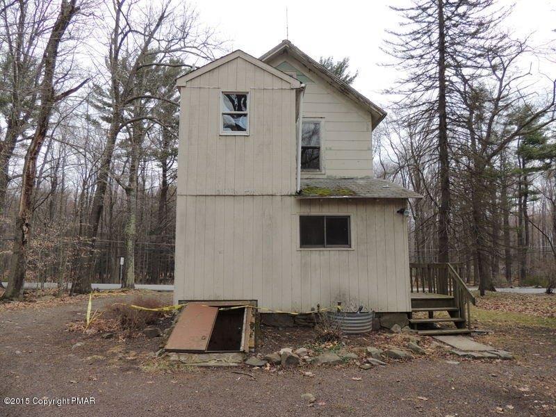 2800 Locust Ridge Road Pocono Lake, PA 18347 - Photo 3 of 20 a white house that has a tree in front of it