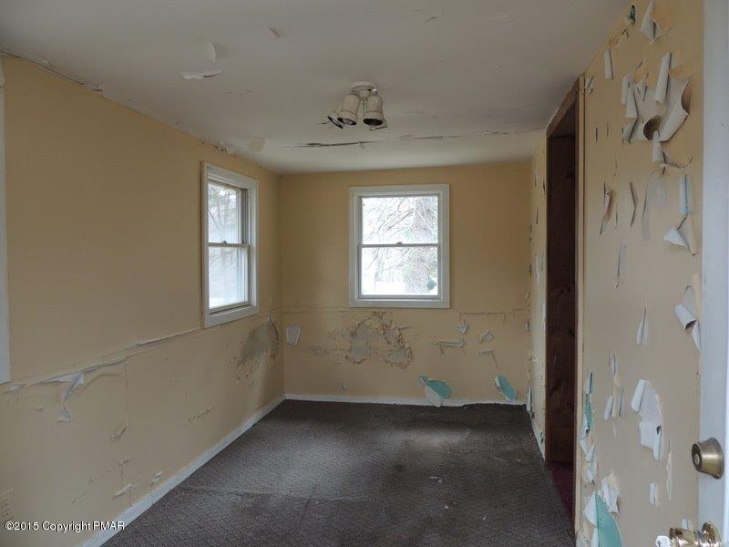 2800 Locust Ridge Road Pocono Lake, PA 18347 - Photo 5 of 20 an empty room with windows and entrance